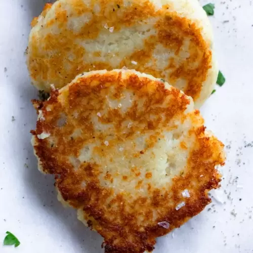 Potato pancake layered on top of another potato pancake.