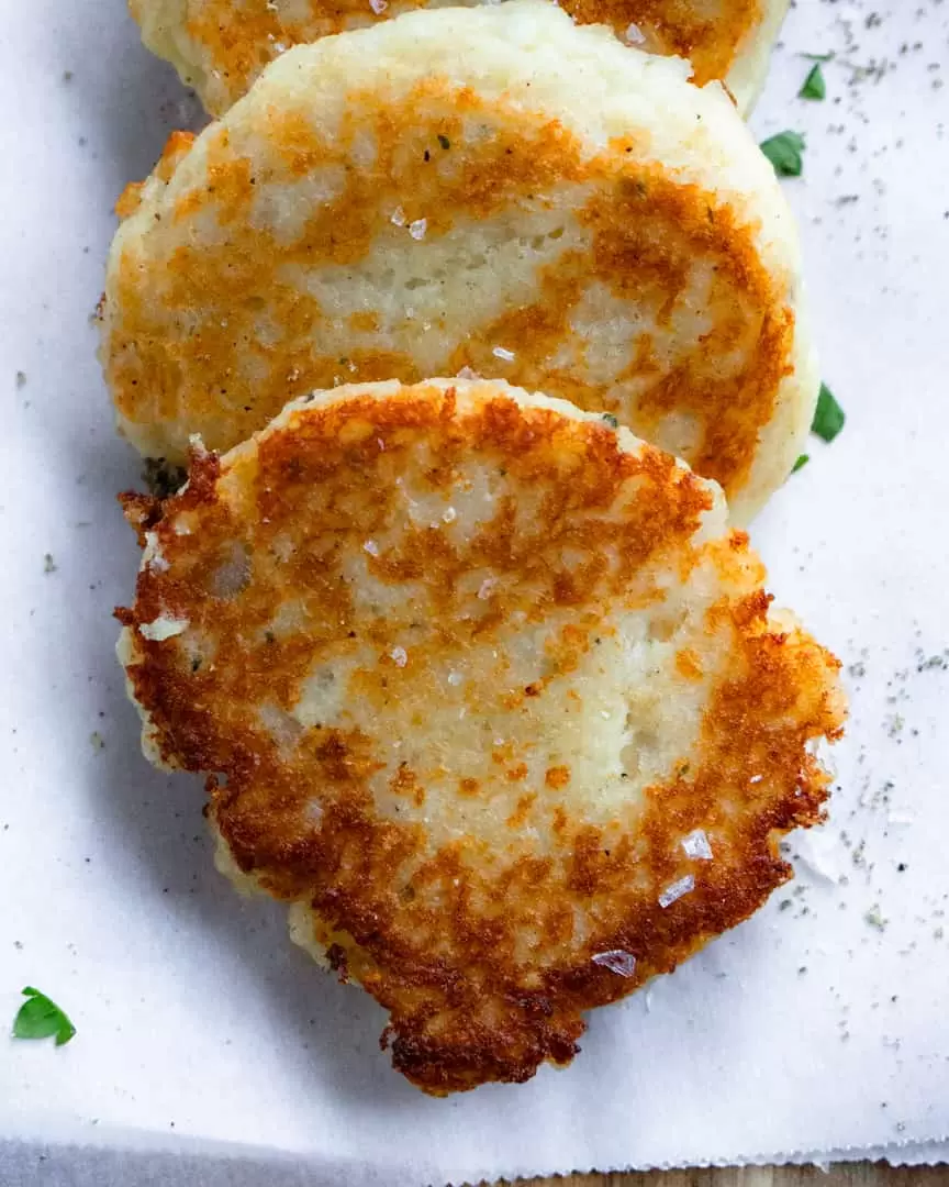Potato pancake layered on top of another potato pancake.
