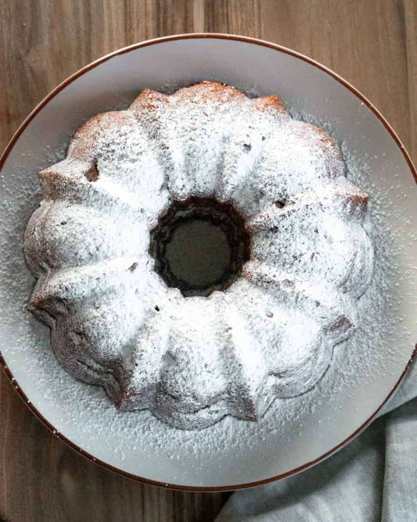 Top down view of a bundt cake with powdered sugar on top
