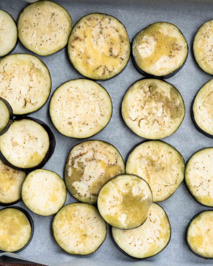 A baking pan of eggplant rounds