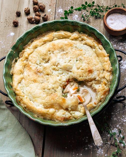 Gluten-Free chicken pot pie with a scoop missing and a spoon ready to grab the next portion
