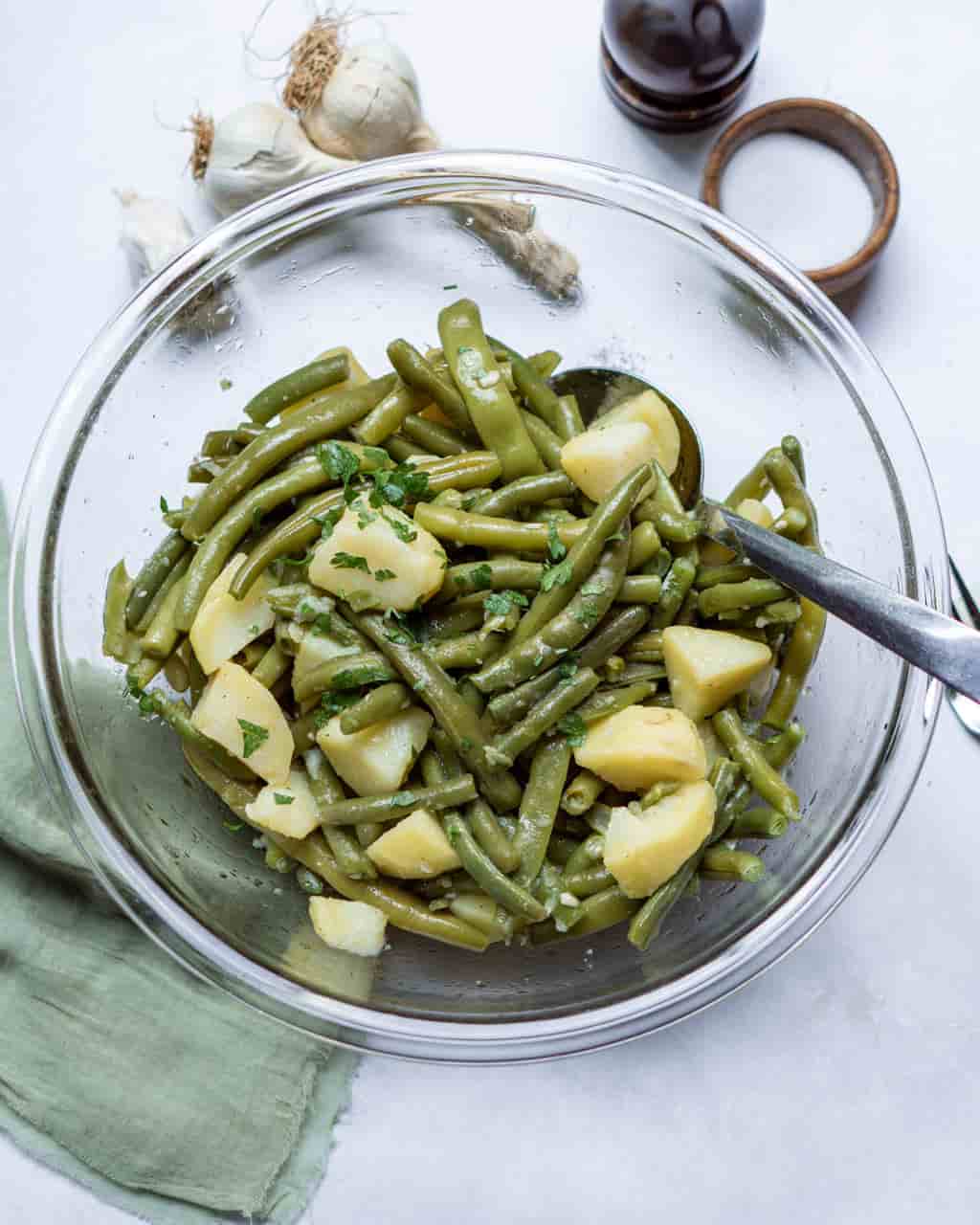 Green Beans and potatoes in a bowl with a spoon