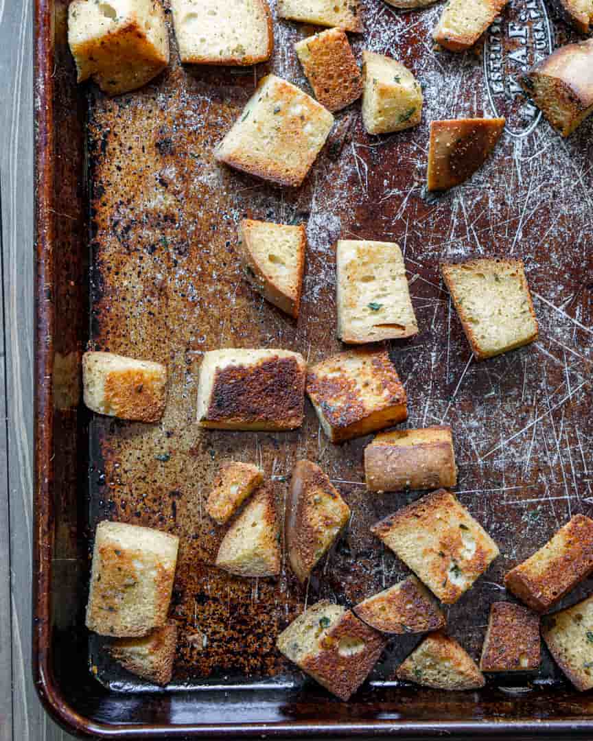 Baking sheet with cooked homemade croutons