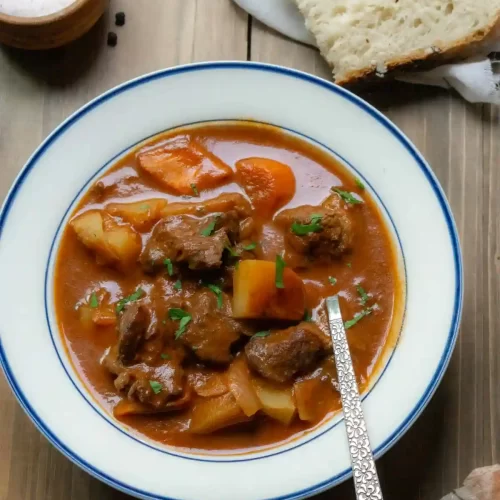 bowl of beef stew with a spoon