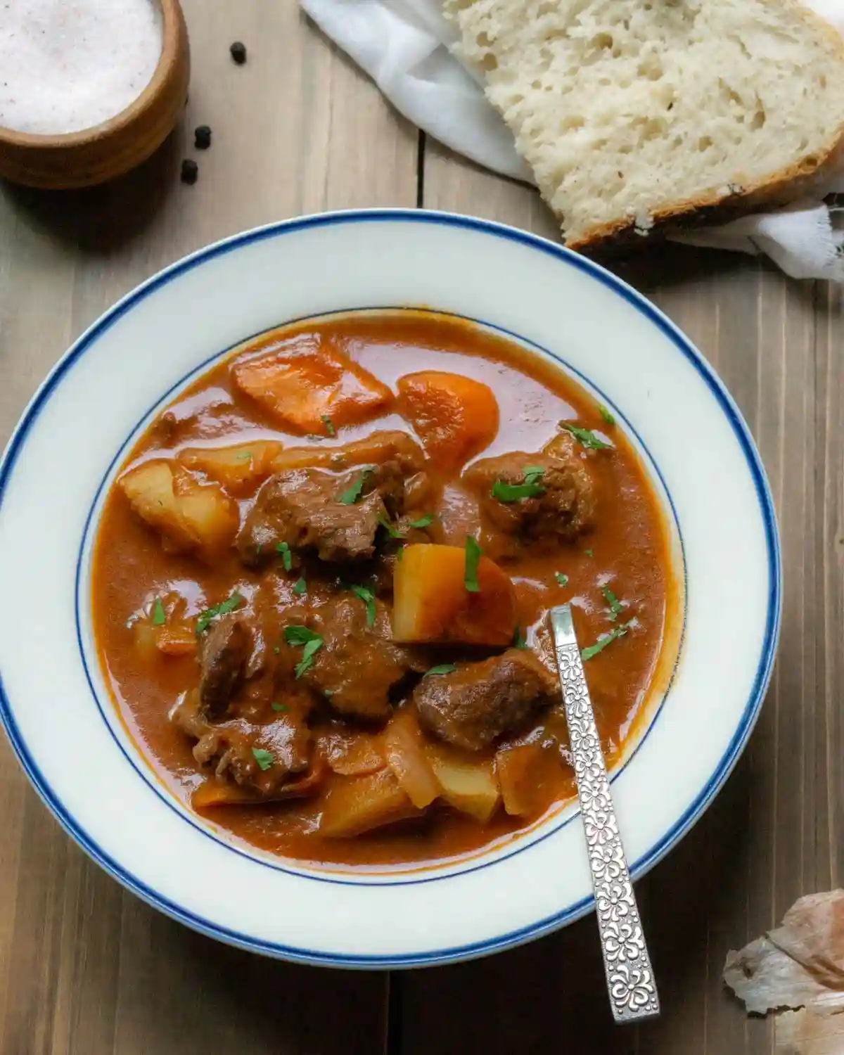 bowl of beef stew with a spoon