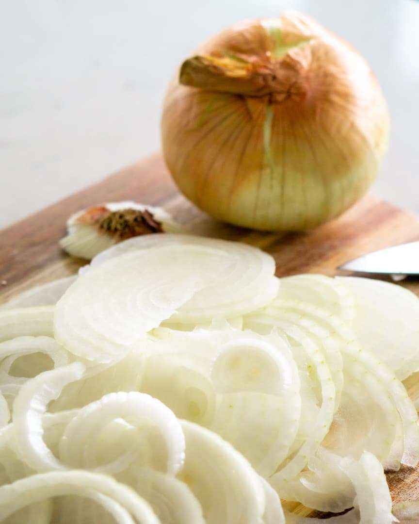 Sliced Vidalia onions on a cutting board