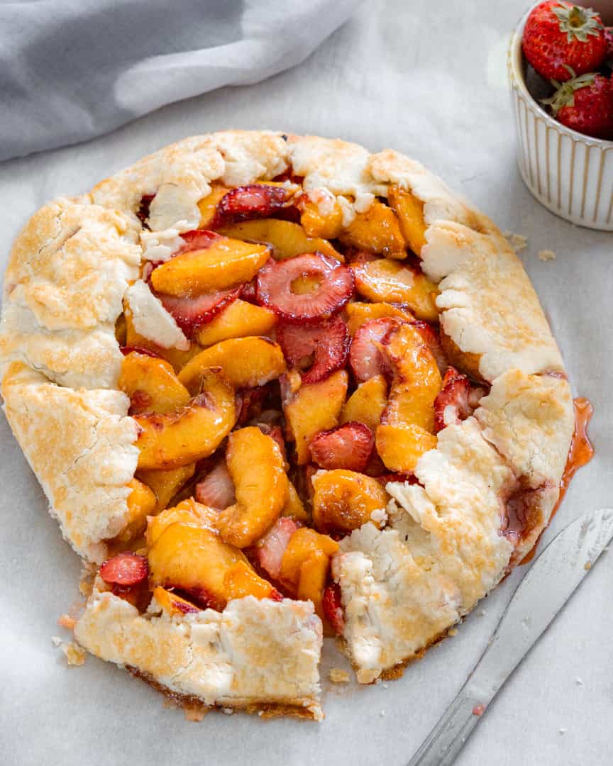 baked galette with a slice cut from it but not removed.