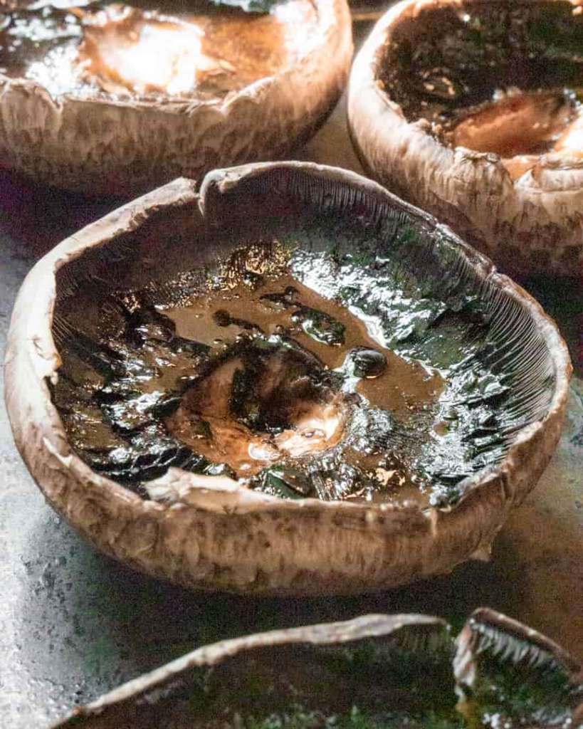 upside down portobello mushroom with olive oil and balsamic glazed brushed onto it.
