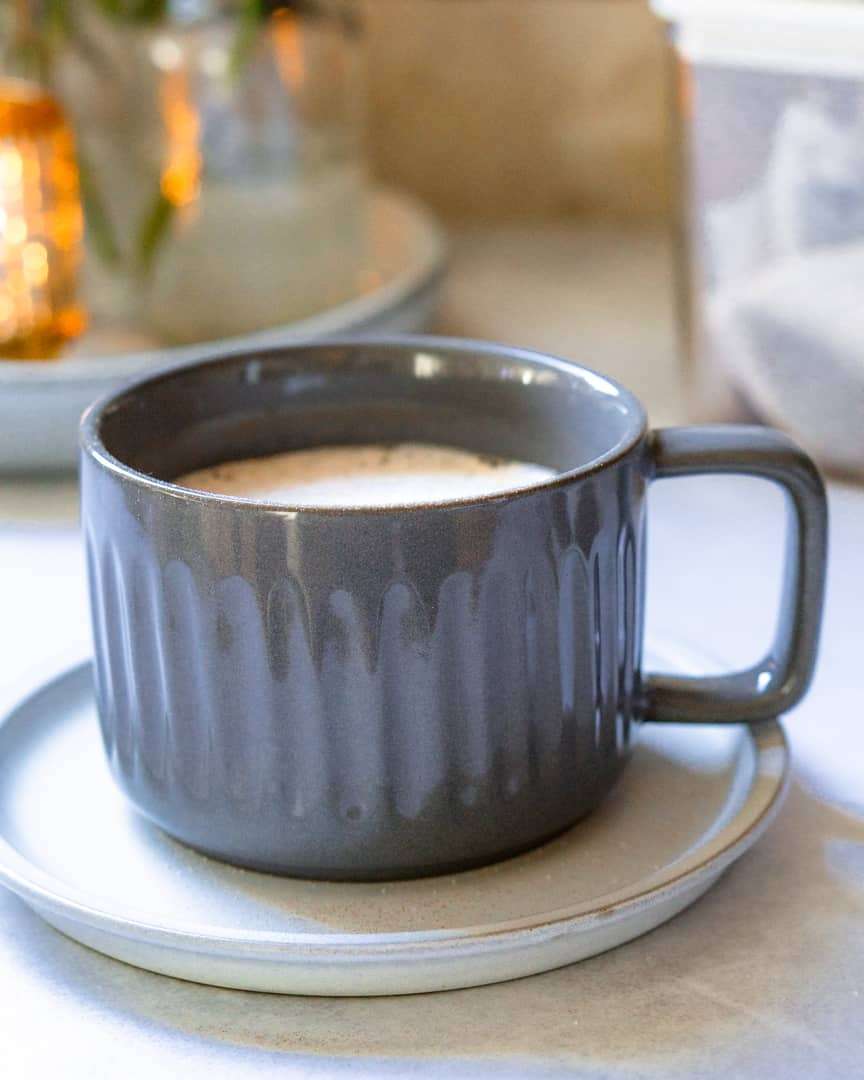 A mug of tea on a small plate
