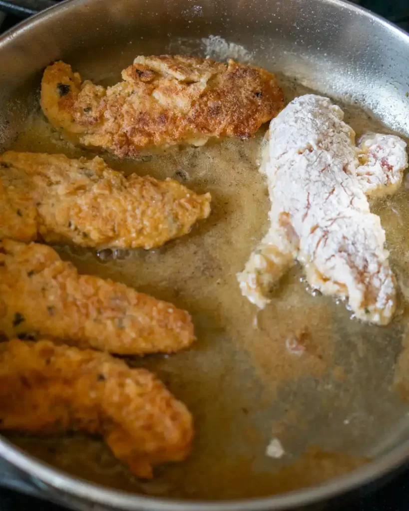 Chicken tenders in a frying pan