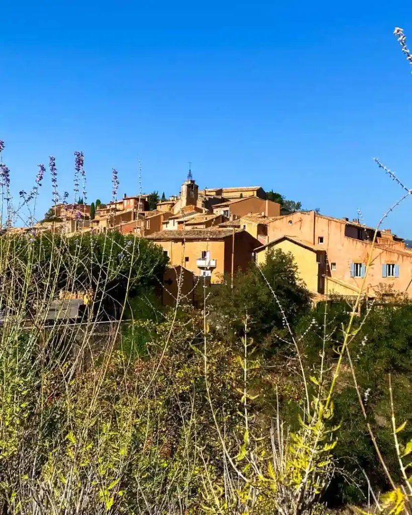 The town of Roussillon perches on the hillside.