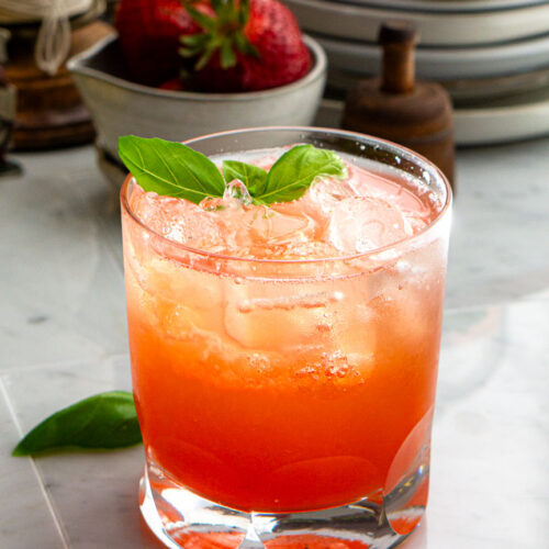 A glass of iced Strawberry Lemon Basil Spritzer