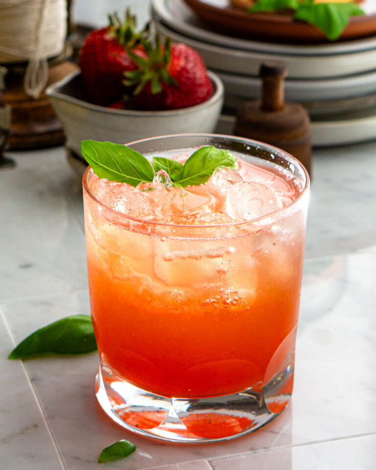 A glass of iced Strawberry Lemon Basil Spritzer