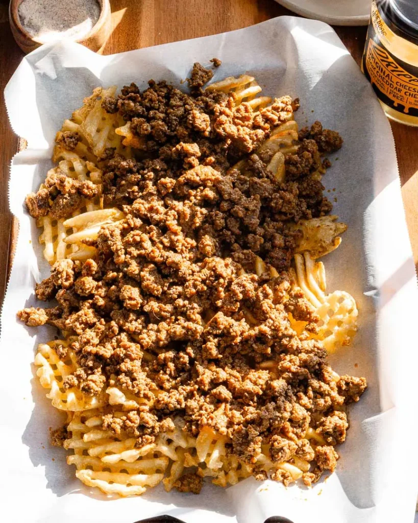 Waffles fries topped with seasoned ground beef.