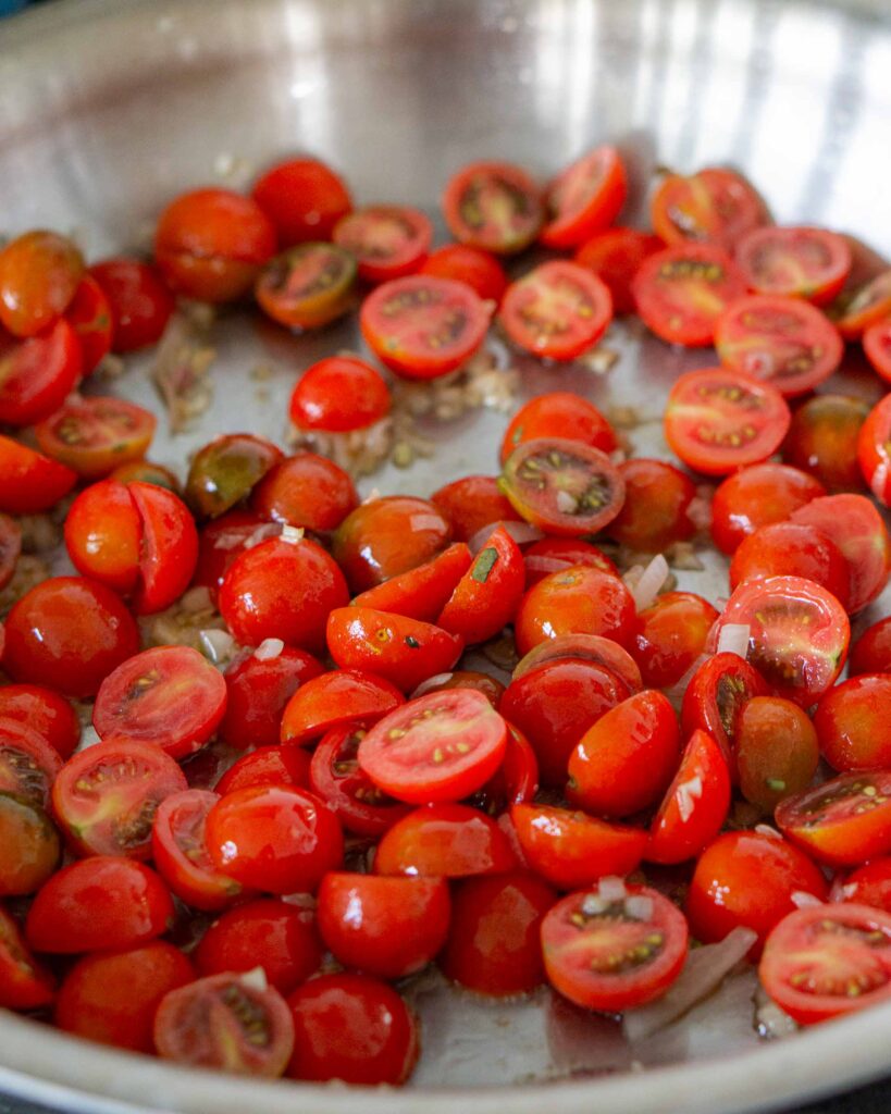Cherry tomatoes in a skillet.