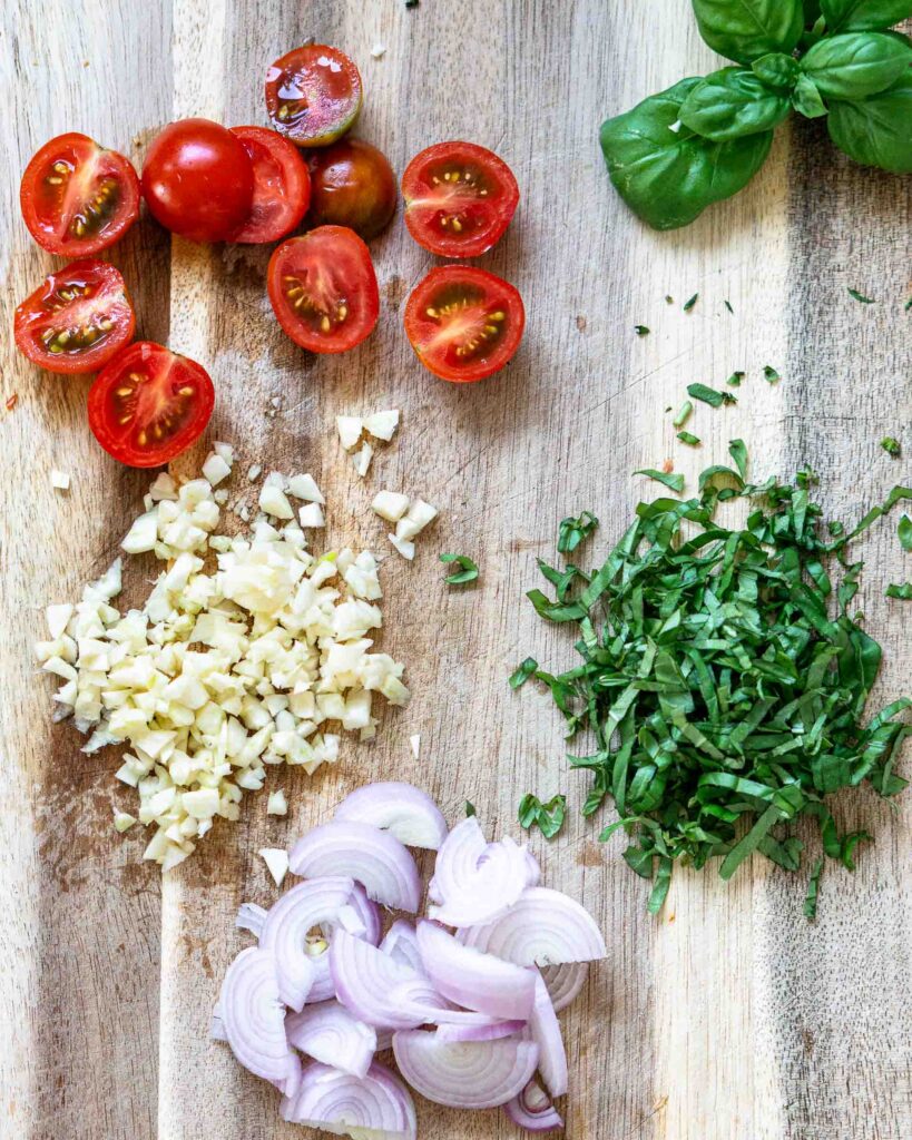 Mis en place for pasta with cherry tomatoes.